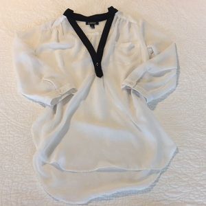 A Byer black and white sheer blouse